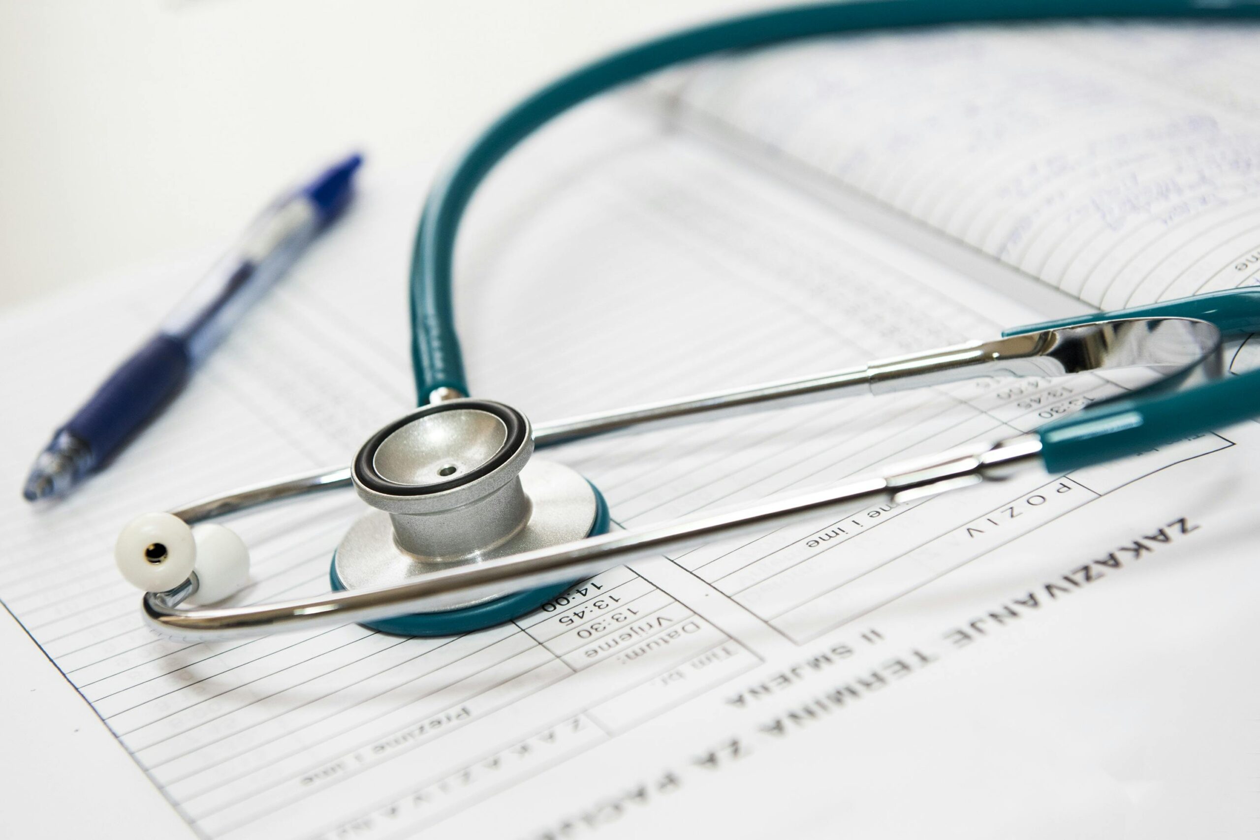 Stethoscope sitting on top of medical documents