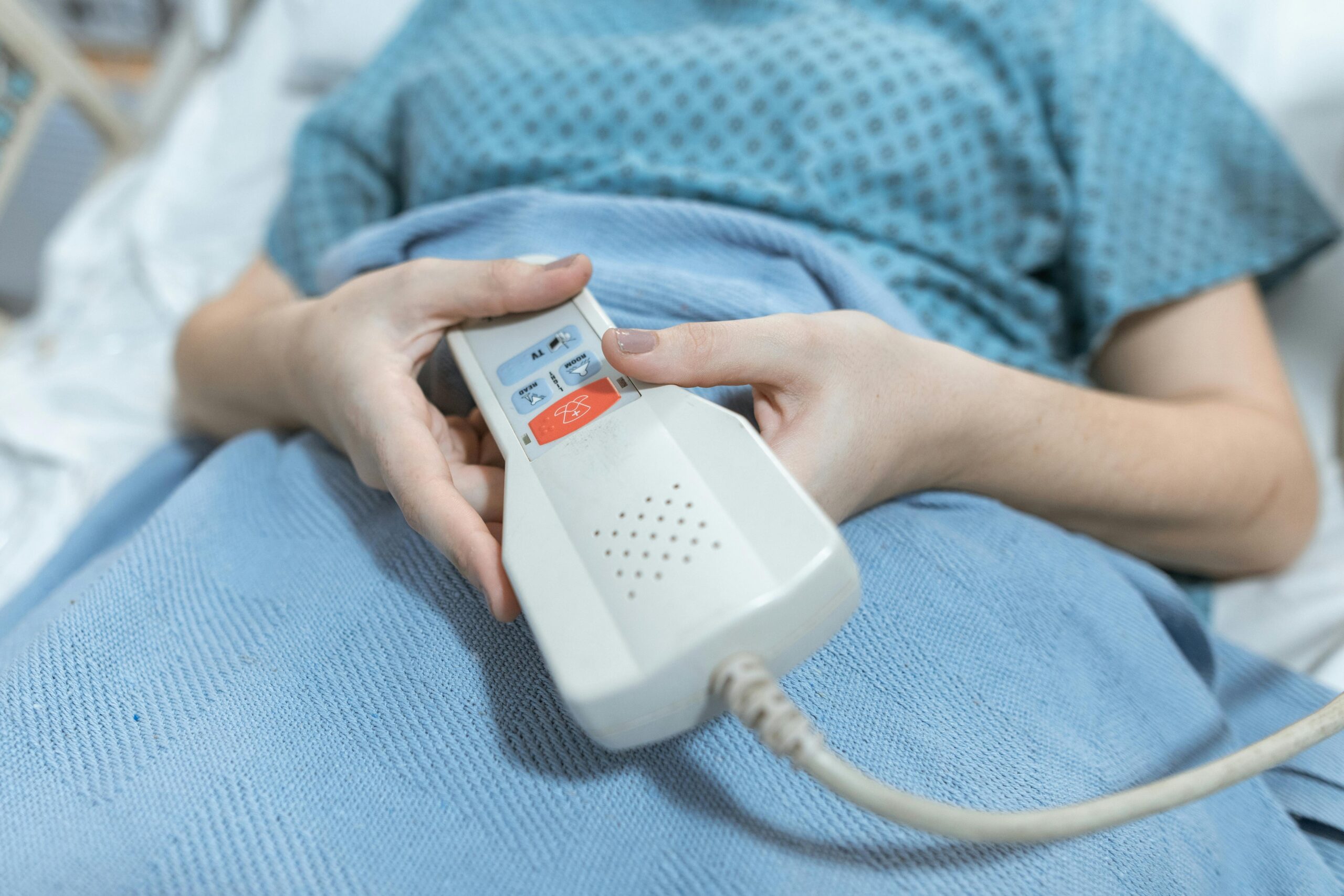 Woman adjusting her hospital bed