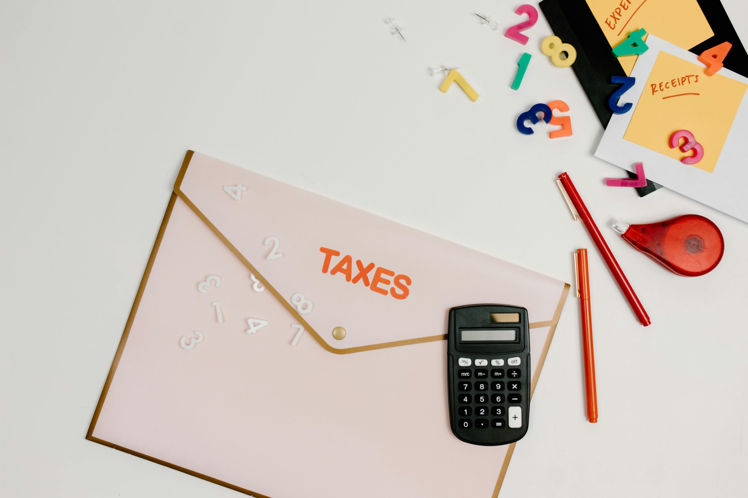 pexels-tara-winstead-7111489 Envelope with "Taxes" written on it and a calculator.