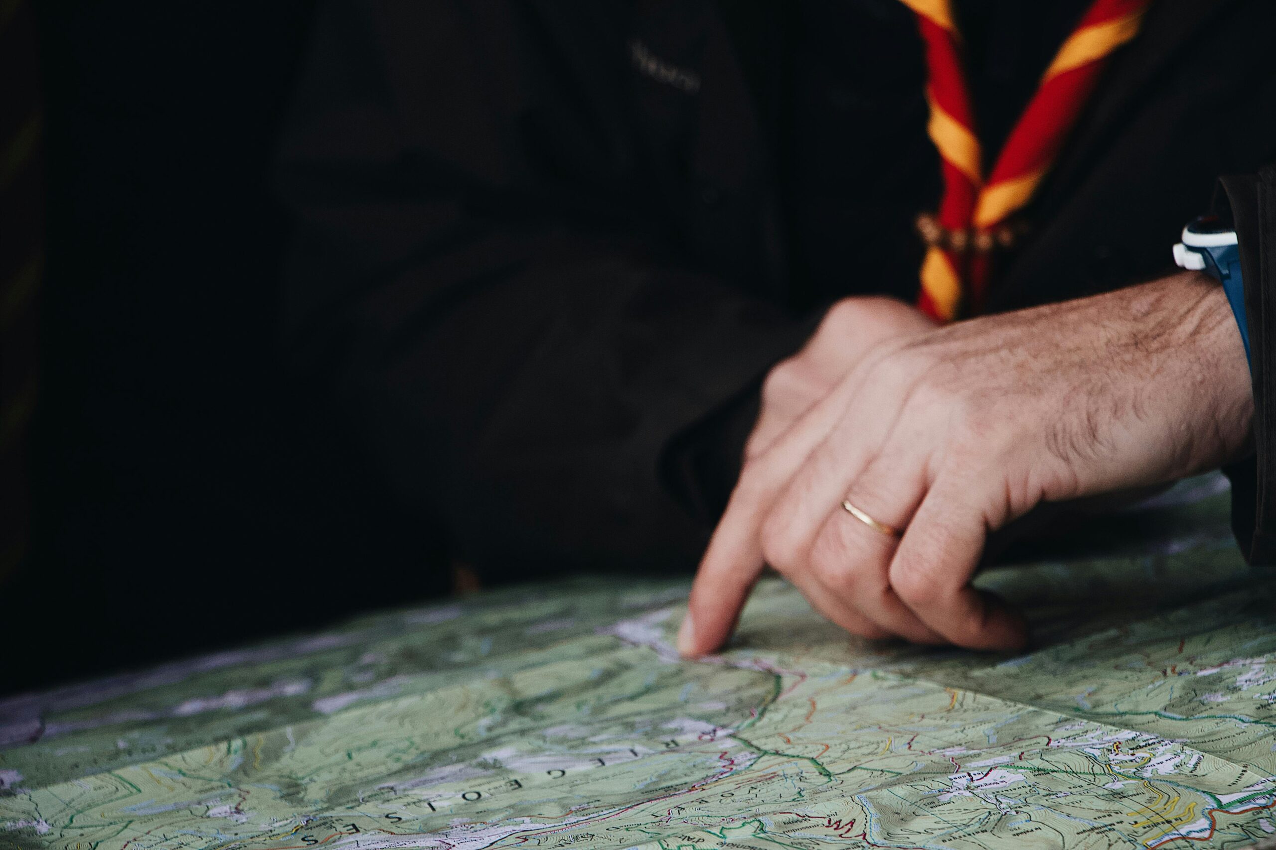 Hand pointing on map